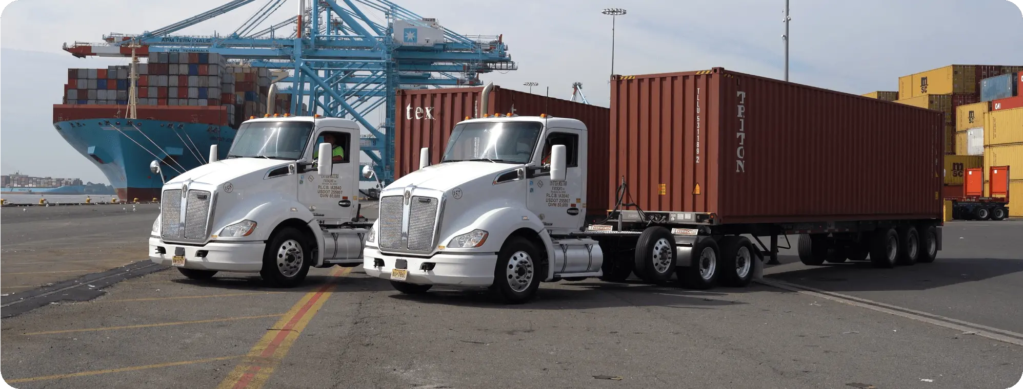 IMFI trucks and containers at a port.