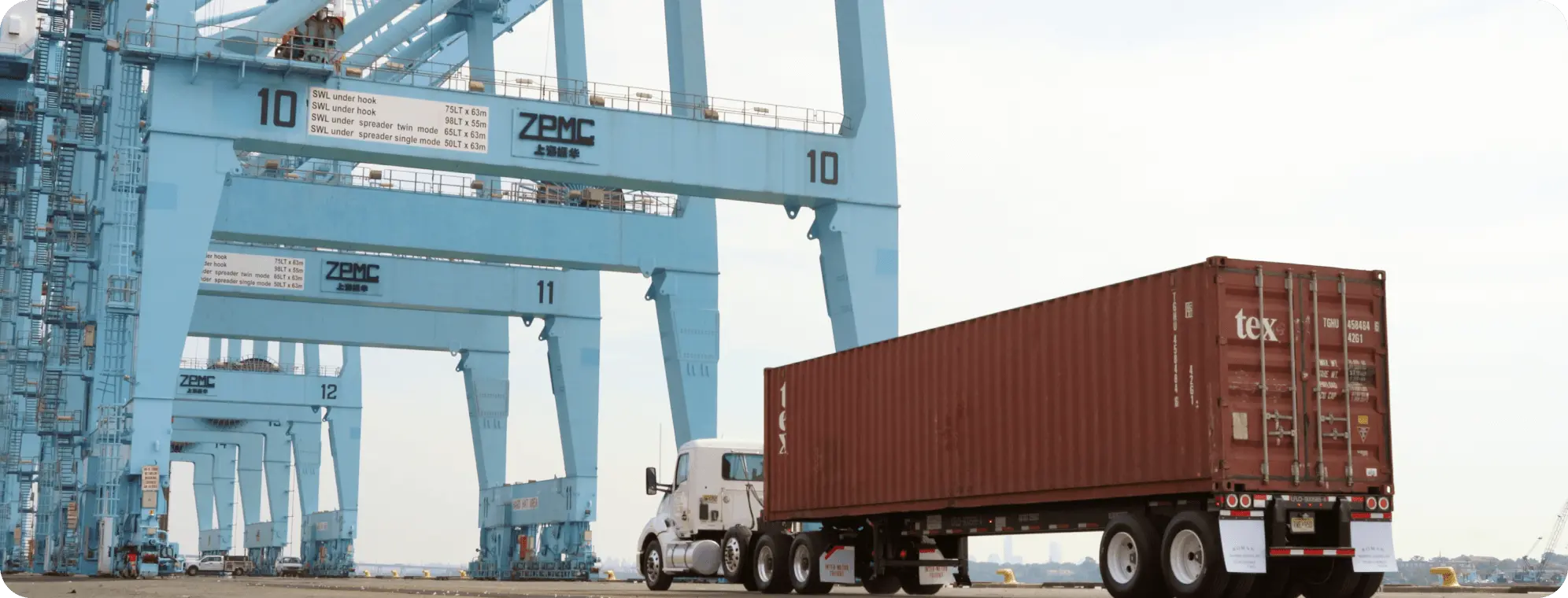 IMFI truck hauling a container from the port.