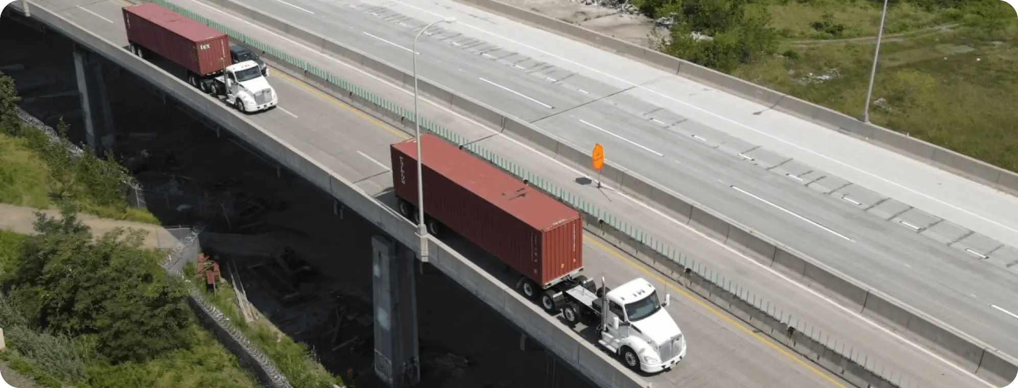 IMFI trucks on the freeway.