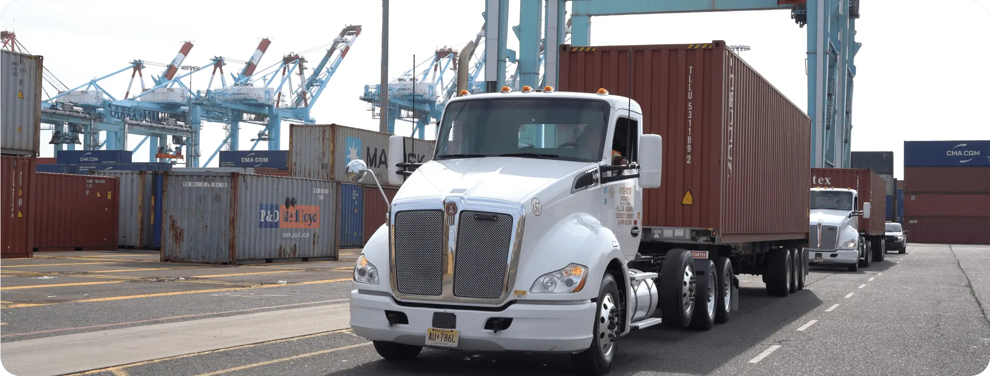 IMFI trucks hauling drayage containers.