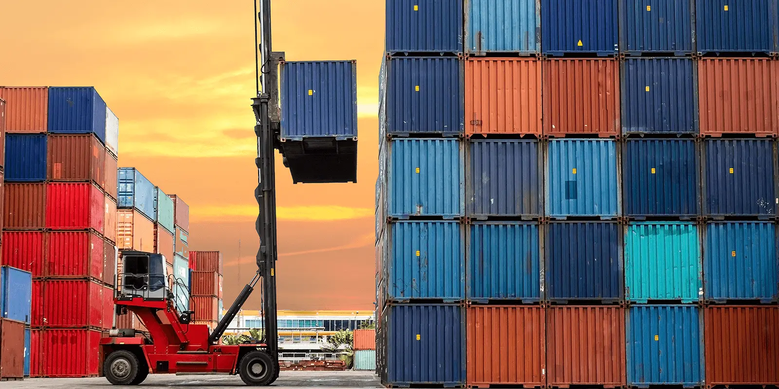 Forklift stacking shipping containers