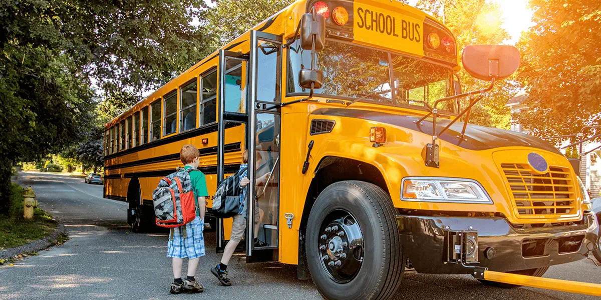 Children boarding a school bus