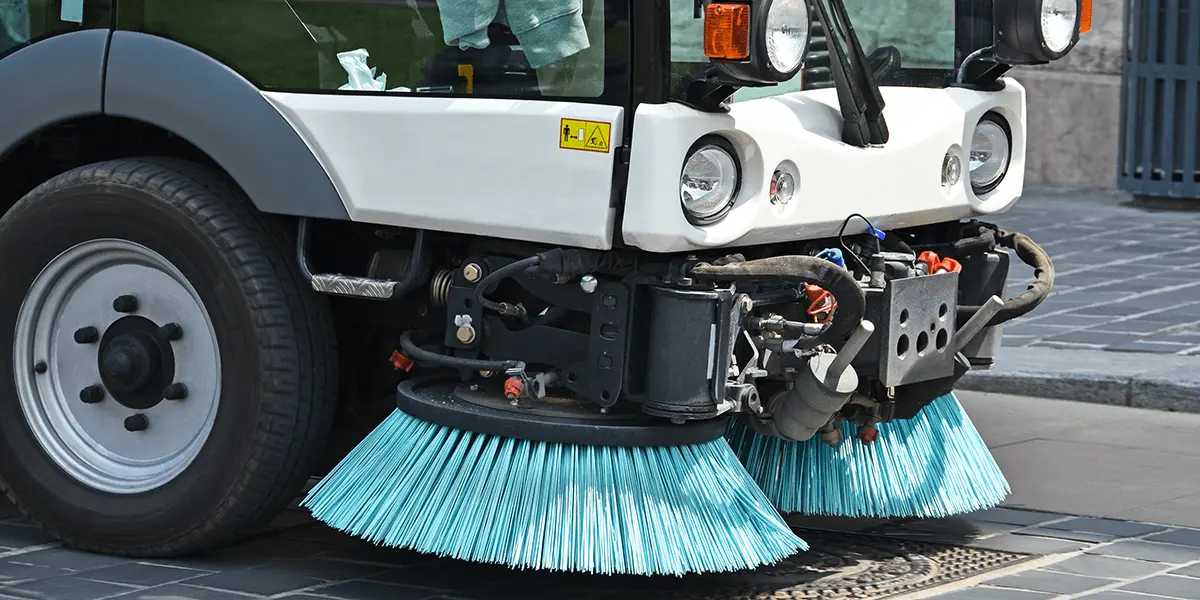 Street cleaner sweeping city streets