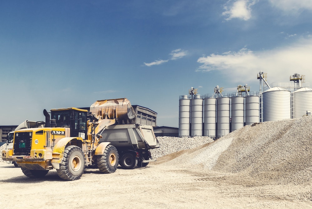 Tractor loading material at a gravel bed.