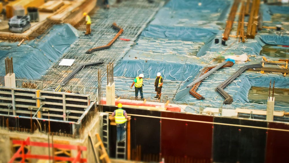 Construction workers assessing project requirements.