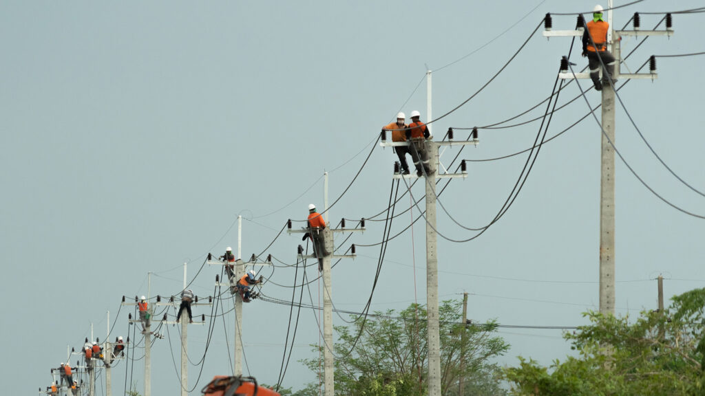 Utility workers repairing power lines to get the lights back on.