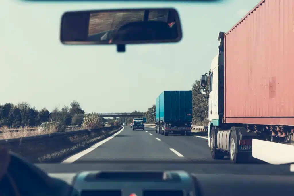 Multiple trucks on a highway.